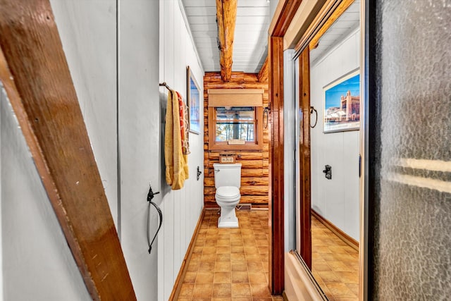 hall featuring beamed ceiling