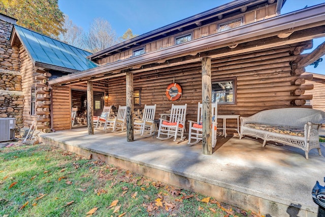 exterior space featuring cooling unit and covered porch