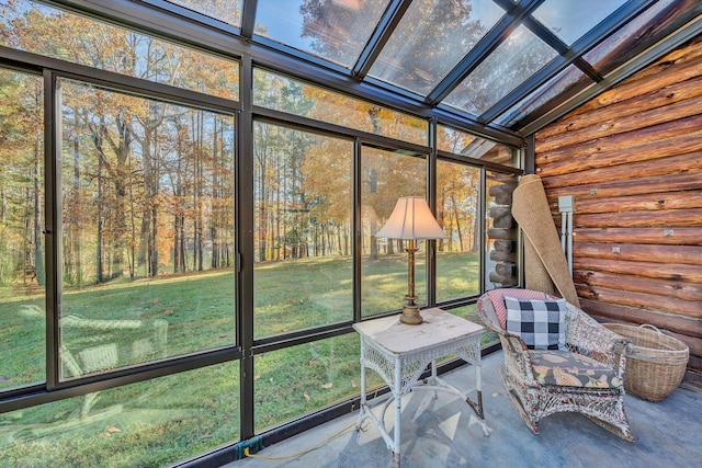 unfurnished sunroom with vaulted ceiling