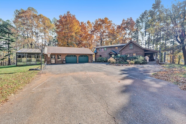view of front of home featuring an outbuilding and a garage