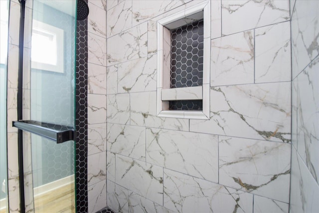 interior space featuring a tile shower