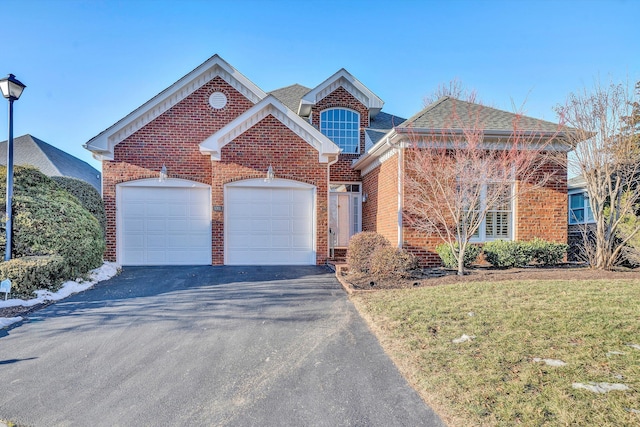 front of property featuring a garage and a front yard