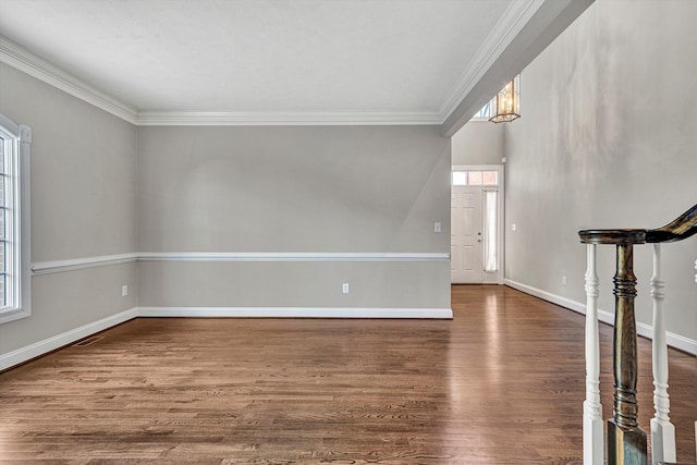 additional living space with wood-type flooring and a wealth of natural light