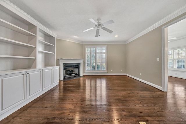 unfurnished living room featuring dark wood-type flooring, crown molding, a textured ceiling, built in features, and ceiling fan