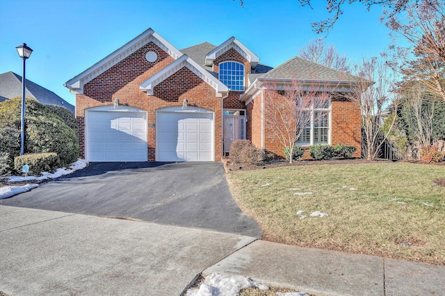 front of property featuring a garage and a front yard