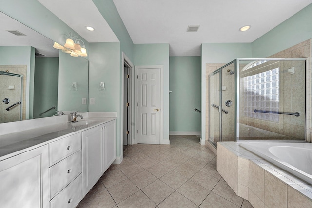 bathroom featuring vanity, tile patterned floors, and plus walk in shower