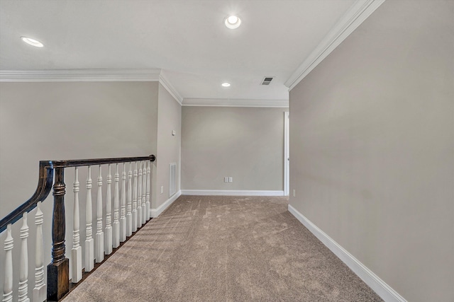 carpeted spare room with ornamental molding