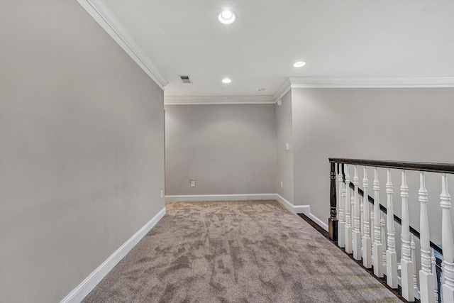 unfurnished room featuring ornamental molding and carpet flooring