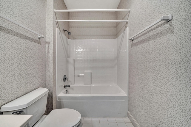 bathroom featuring shower / bathtub combination, tile patterned floors, and toilet