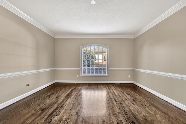 spare room with ornamental molding, dark hardwood / wood-style flooring, and a textured ceiling