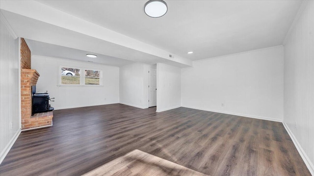 unfurnished living room featuring dark wood-style floors and baseboards