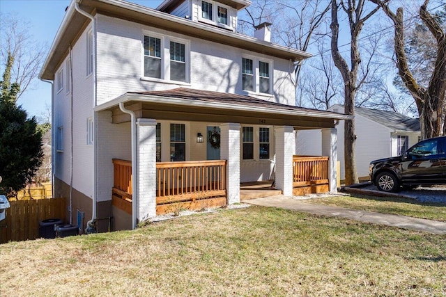 view of front of home featuring a porch and a front yard