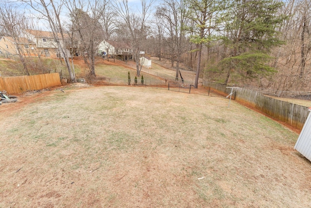 view of yard with a fenced backyard