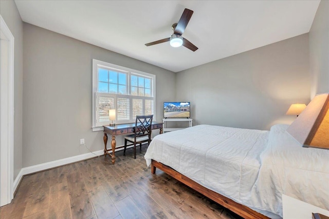 bedroom with wood-type flooring, baseboards, and ceiling fan