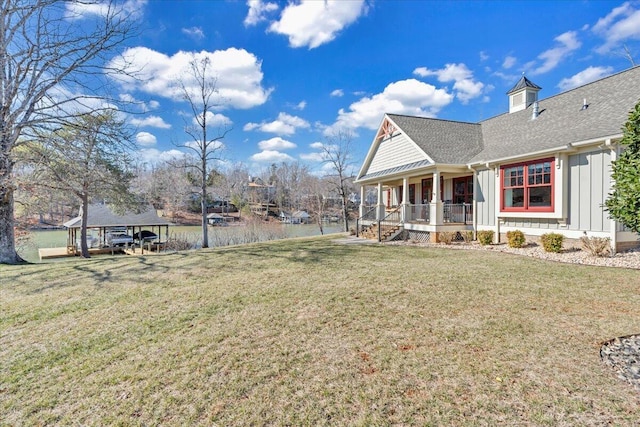 view of yard featuring a porch and a carport