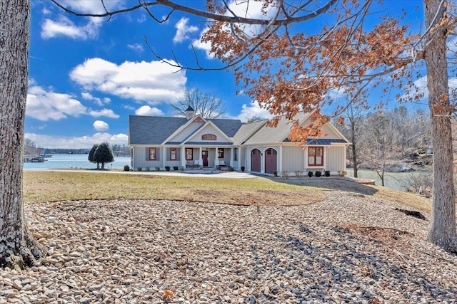 view of front of house featuring a water view and a front yard