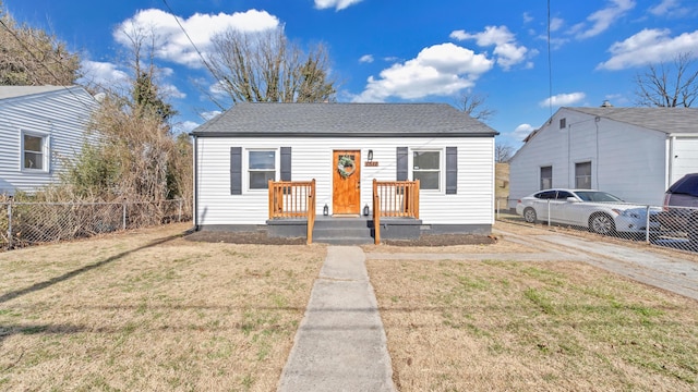 bungalow-style home featuring a front yard