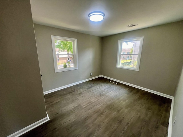 empty room featuring dark hardwood / wood-style floors