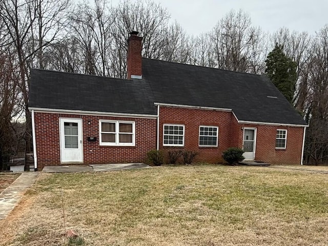 45 Hillcrest Dr, Rocky Mount, VA 24151 - view of front of property with brick siding, a front yard, concrete driveway, and a chimney