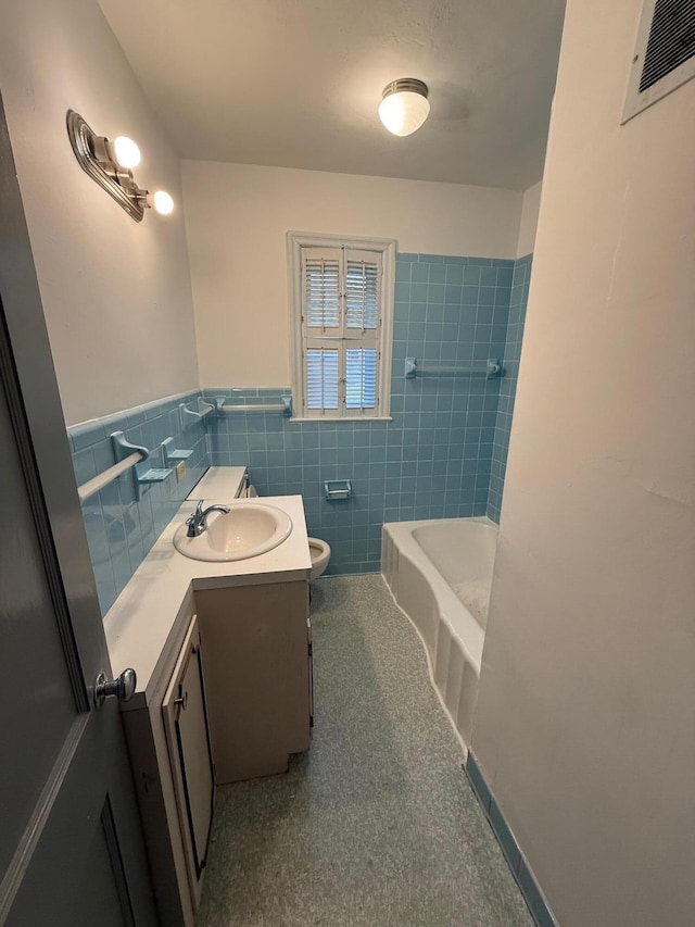 45 Hillcrest Dr, Rocky Mount, VA 24151 - full bathroom featuring tile walls, a wainscoted wall, visible vents, toilet, and vanity