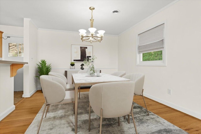 1909 Pelham Dr, Roanoke, VA 24018 - dining area featuring a healthy amount of sunlight, an inviting chandelier, ornamental molding, and visible vents