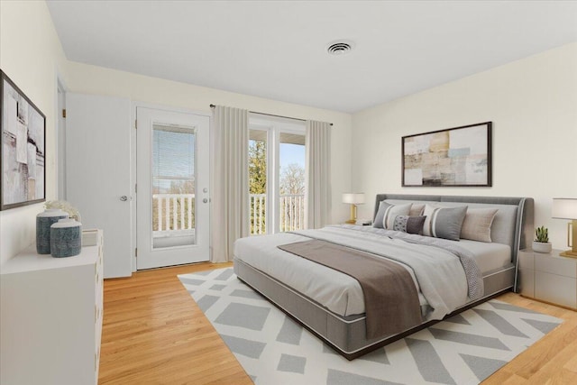 1909 Pelham Dr, Roanoke, VA 24018 - bedroom with light wood-type flooring, visible vents, and access to exterior