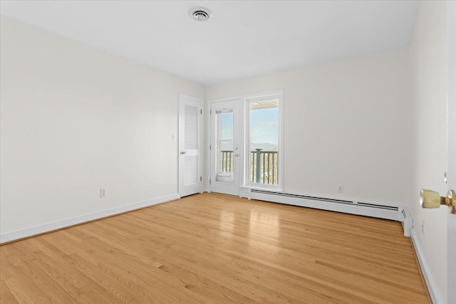 1909 Pelham Dr, Roanoke, VA 24018 - unfurnished room featuring visible vents, light wood-style flooring, baseboards, and baseboard heating