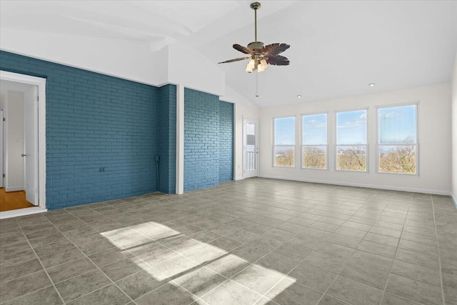 1909 Pelham Dr, Roanoke, VA 24018 - unfurnished living room featuring baseboards, brick wall, ceiling fan, tile patterned floors, and lofted ceiling