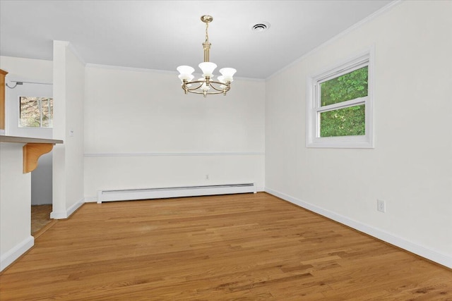 spare room with a baseboard radiator, visible vents, crown molding, and wood finished floors