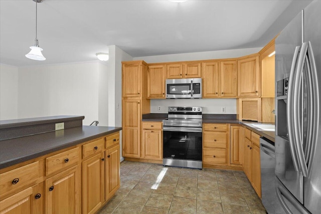 kitchen with light tile patterned floors, stainless steel appliances, dark countertops, and decorative light fixtures