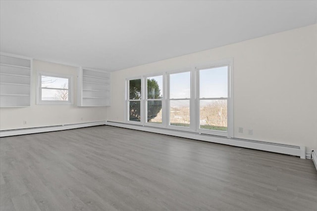 1909 Pelham Dr, Roanoke, VA 24018 - unfurnished living room featuring wood finished floors and a healthy amount of sunlight