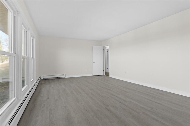 1909 Pelham Dr, Roanoke, VA 24018 - spare room featuring a baseboard radiator, wood finished floors, and baseboards