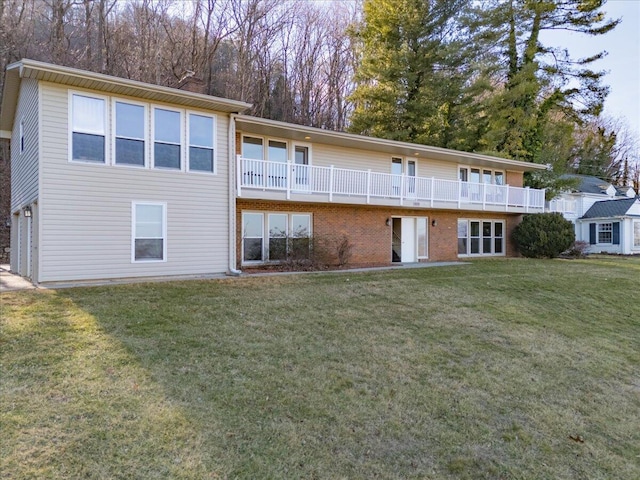 back of property with brick siding, a lawn, and a chimney