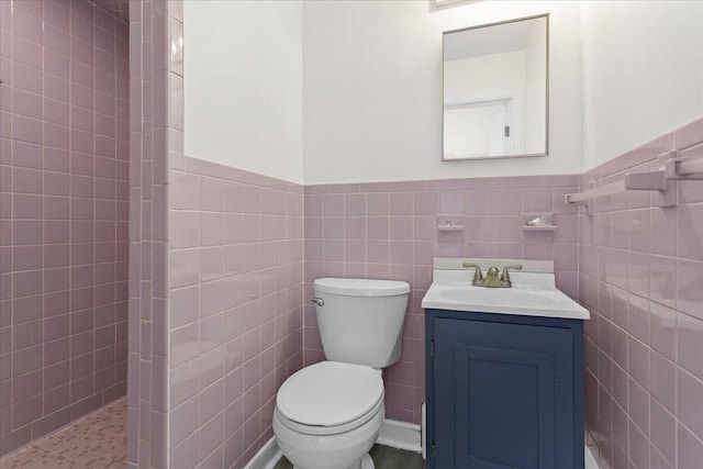 1909 Pelham Dr, Roanoke, VA 24018 - bathroom with walk in shower, toilet, tile walls, vanity, and wainscoting