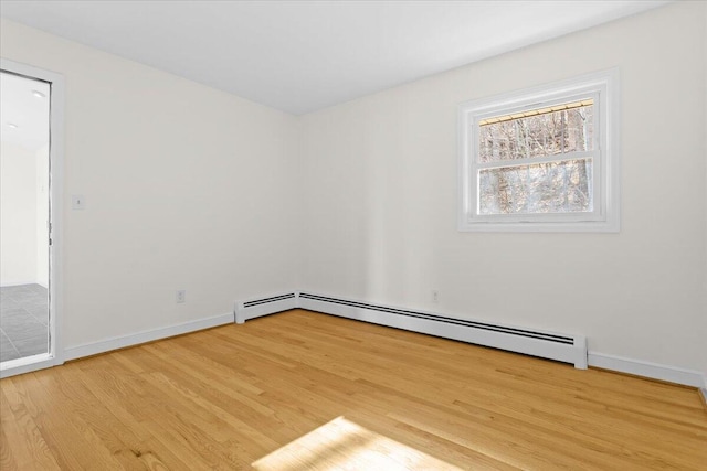 1909 Pelham Dr, Roanoke, VA 24018 - unfurnished room with a baseboard radiator, wood finished floors, and baseboards