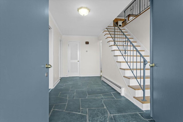 hall featuring stairs, stone finish floor, a baseboard radiator, and baseboards