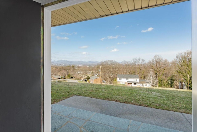 view of yard with a patio area and a mountain view