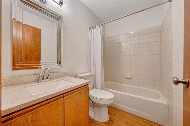 3615 Dogwood Ln SW, Roanoke, VA 24015 - bathroom with toilet, wood finished floors, vanity, and shower / bath combo with shower curtain