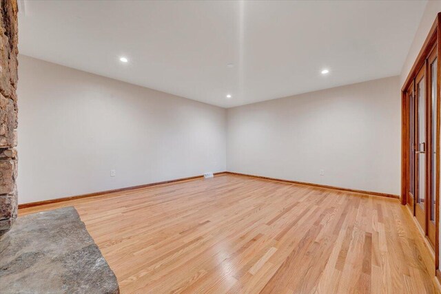 3615 Dogwood Ln SW, Roanoke, VA 24015 - unfurnished living room featuring light wood-style flooring, recessed lighting, and baseboards