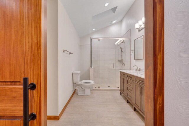 3615 Dogwood Ln SW, Roanoke, VA 24015 - bathroom with a skylight, vaulted ceiling, toilet, a shower stall, and vanity