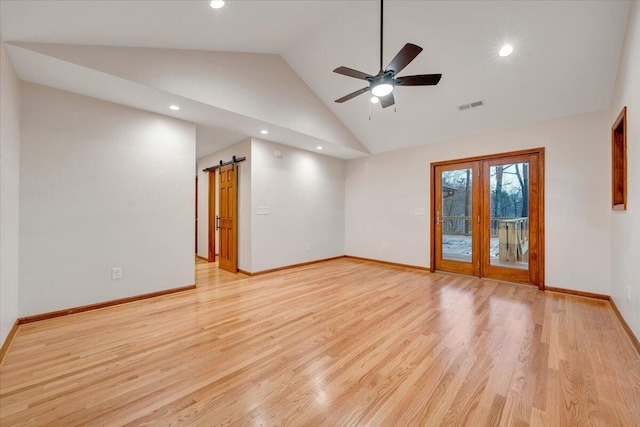 3615 Dogwood Ln SW, Roanoke, VA 24015 - spare room featuring a barn door, recessed lighting, ceiling fan, light wood finished floors, and baseboards
