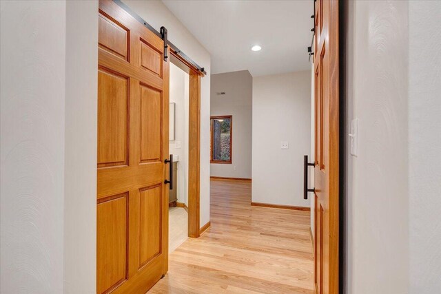 3615 Dogwood Ln SW, Roanoke, VA 24015 - corridor featuring a barn door, light wood-type flooring, baseboards, and recessed lighting