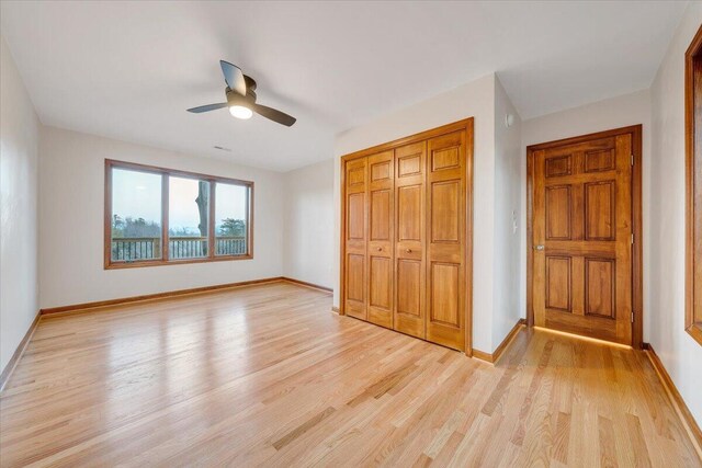 3615 Dogwood Ln SW, Roanoke, VA 24015 - unfurnished bedroom with light wood-type flooring, baseboards, a closet, and ceiling fan