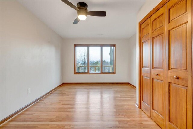 3615 Dogwood Ln SW, Roanoke, VA 24015 - unfurnished bedroom featuring light wood-style flooring, baseboards, a closet, and ceiling fan