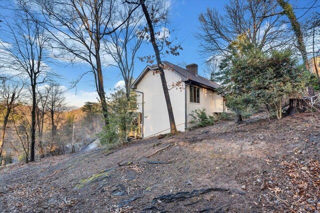 3615 Dogwood Ln SW, Roanoke, VA 24015 - view of side of home featuring an outdoor structure and a chimney