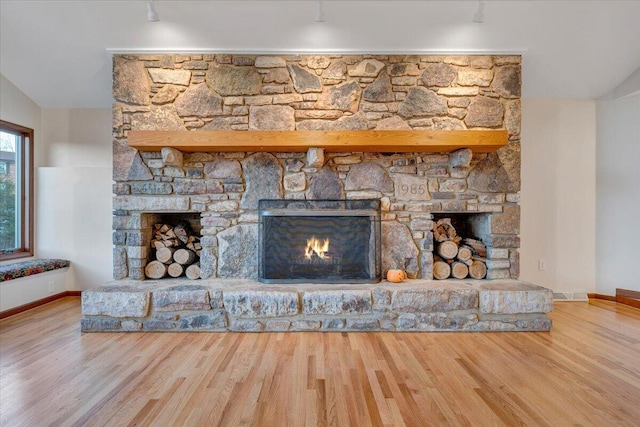 3615 Dogwood Ln SW, Roanoke, VA 24015 - detailed view of a stone fireplace, wood finished floors, and baseboards