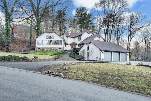 3615 Dogwood Ln SW, Roanoke, VA 24015 - english style home with driveway, a front lawn, and a garage
