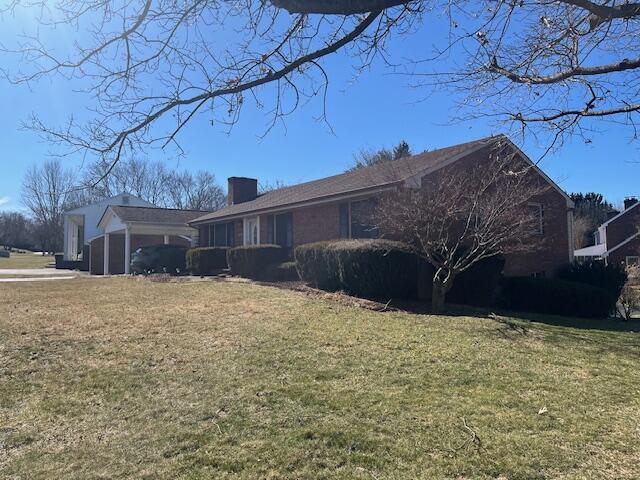 view of home's exterior featuring a lawn