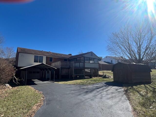 view of front of home featuring a carport