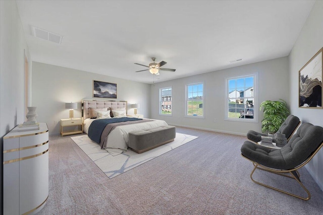 bedroom with visible vents, baseboards, a ceiling fan, and carpet floors